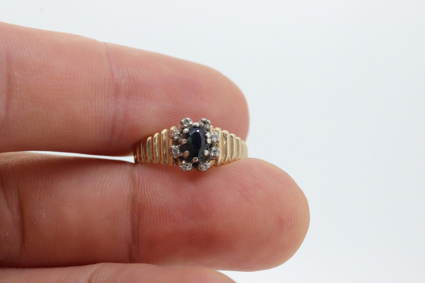 10k Sapphire and diamond Halo ring. 10k Blue sapphire and diamond ribbed band.