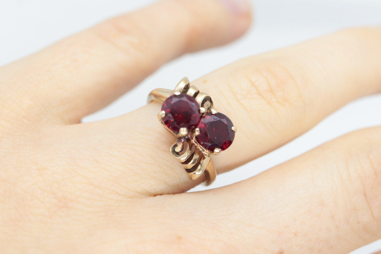 10k Victorian Claw Set Ruby Ring. Twin gem bypass bow ring.