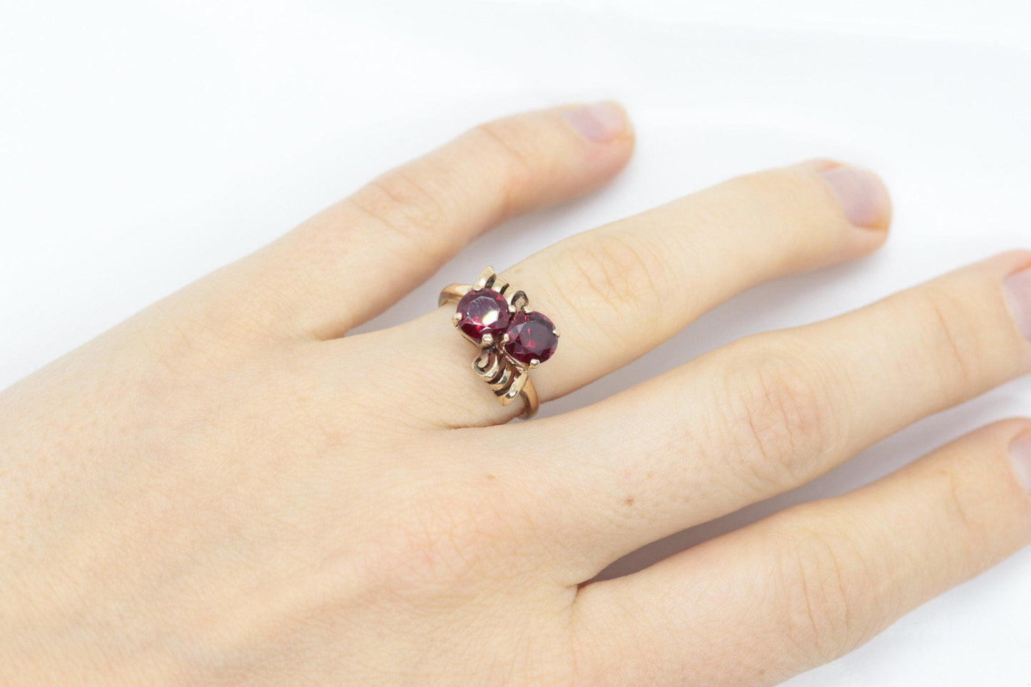 10k Victorian Claw Set Ruby Ring. Twin gem bypass bow ring.