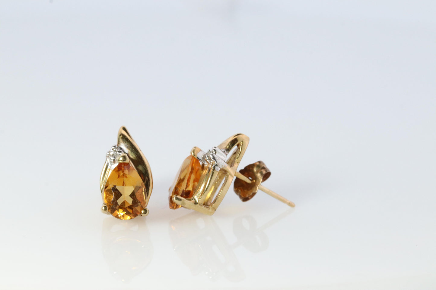 10k Pear Citrine Earrings. Pearl and diamond Bypass stud earrings.