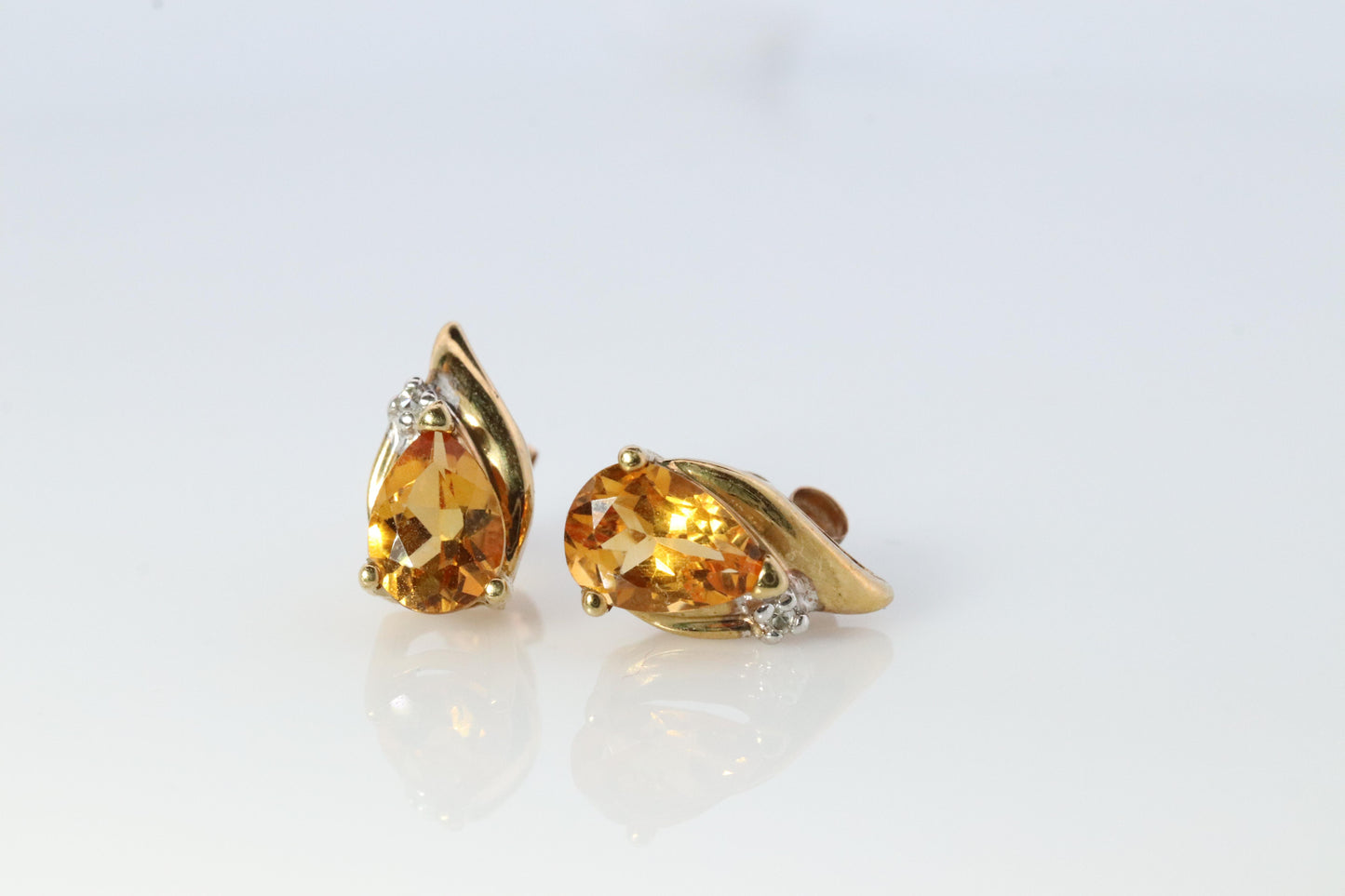 10k Pear Citrine Earrings. Pearl and diamond Bypass stud earrings.