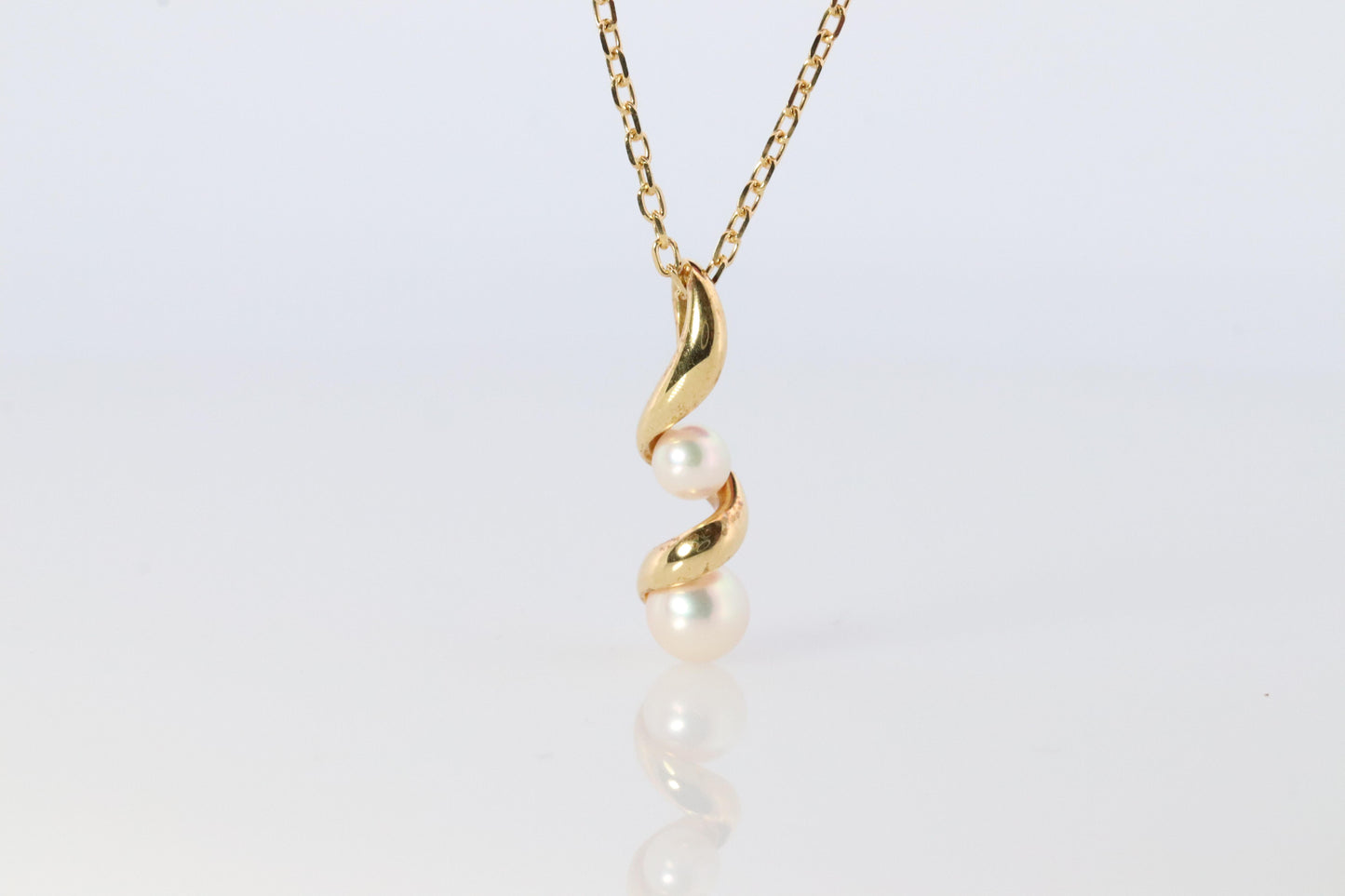 Mikimoto Pendant. 18k Gold Mikimoto Swirl Pearl Necklace.