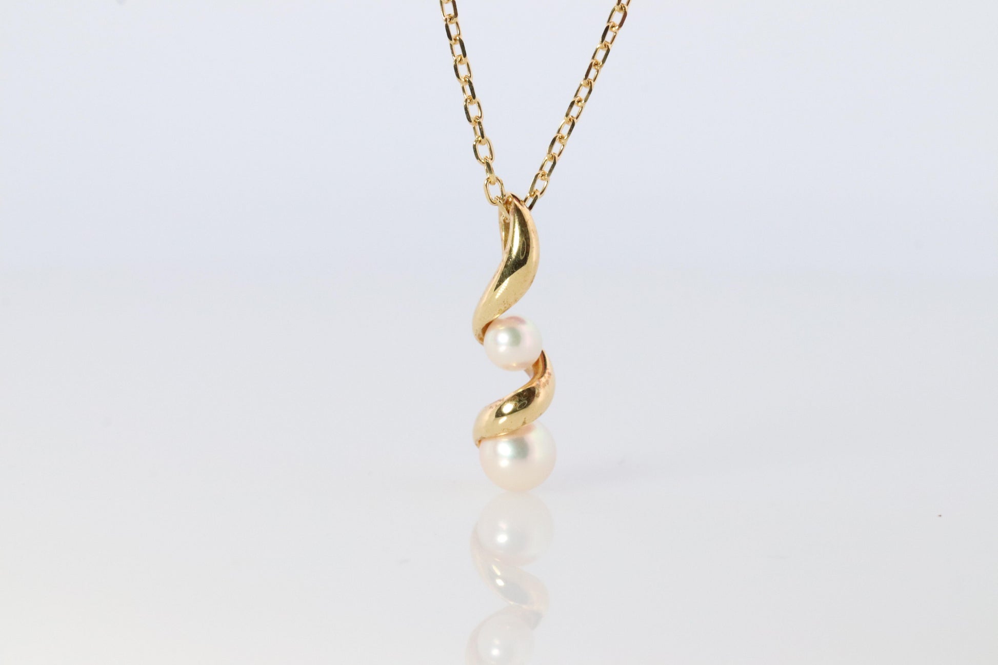 Mikimoto Pendant. 18k Gold Mikimoto Swirl Pearl Necklace.