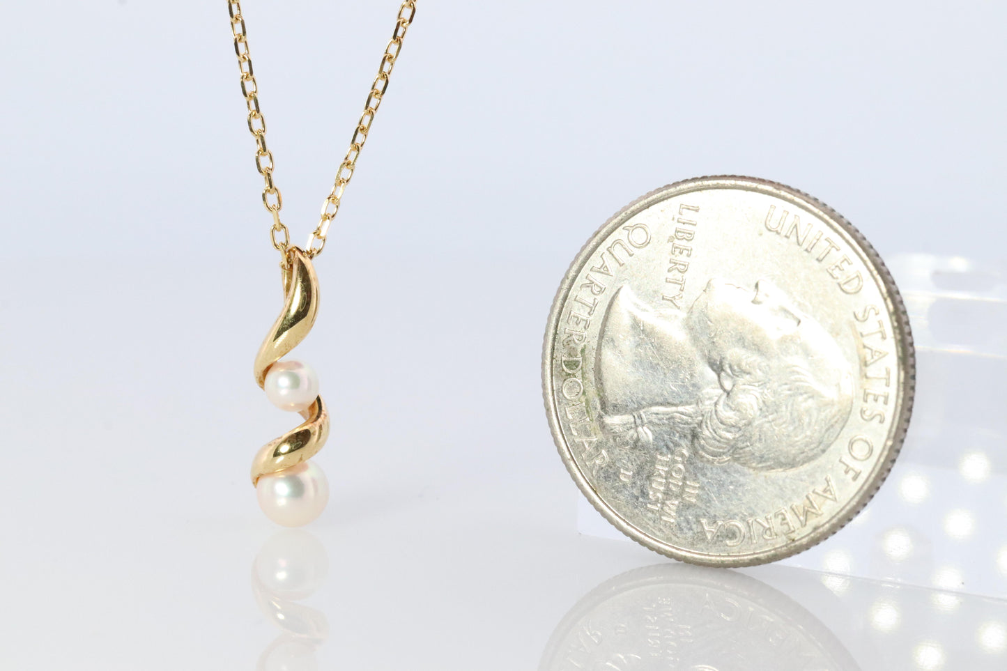 Mikimoto Pendant. 18k Gold Mikimoto Swirl Pearl Necklace.