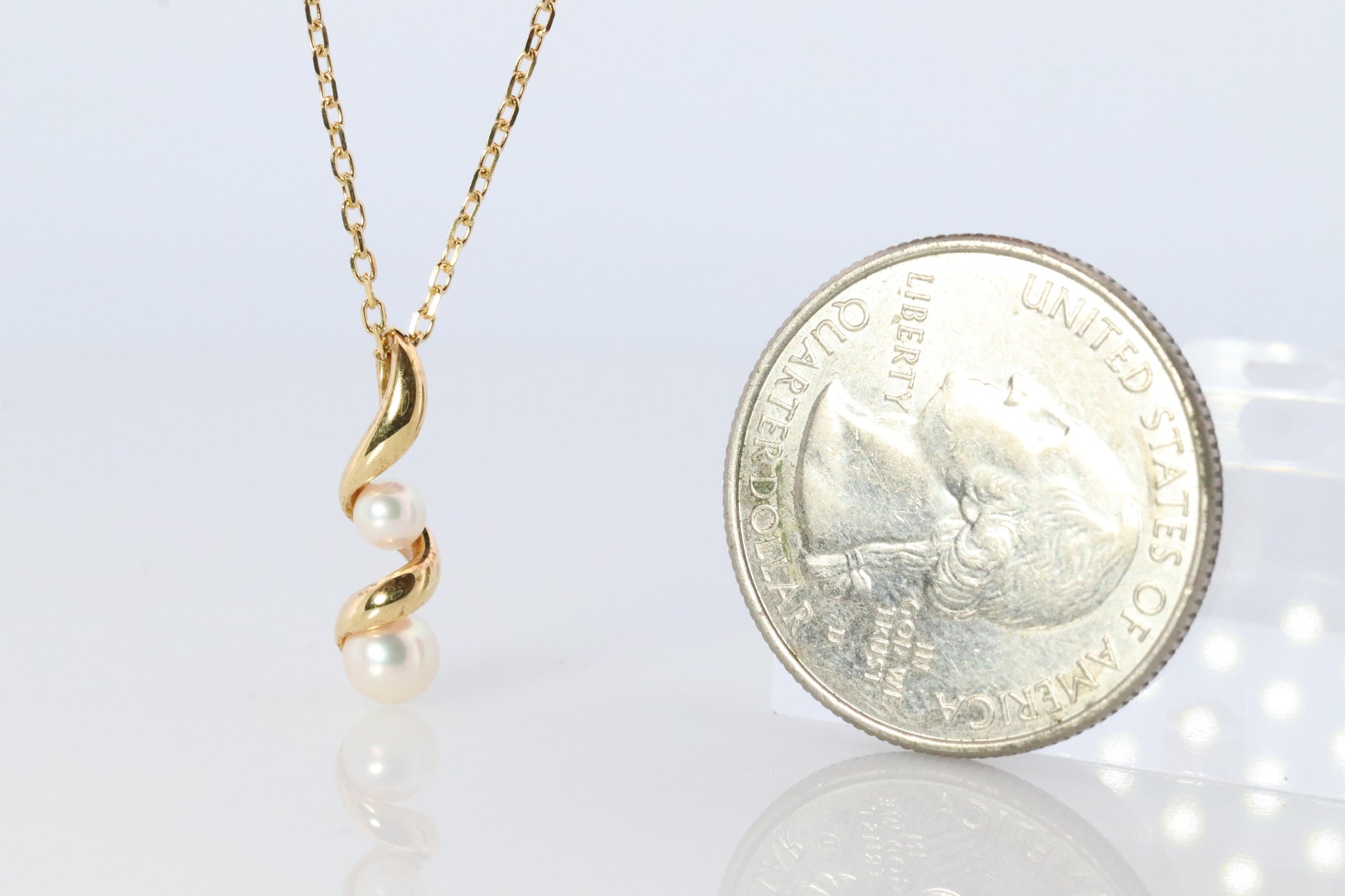 Mikimoto Pendant. 18k Gold Mikimoto Swirl Pearl Necklace.