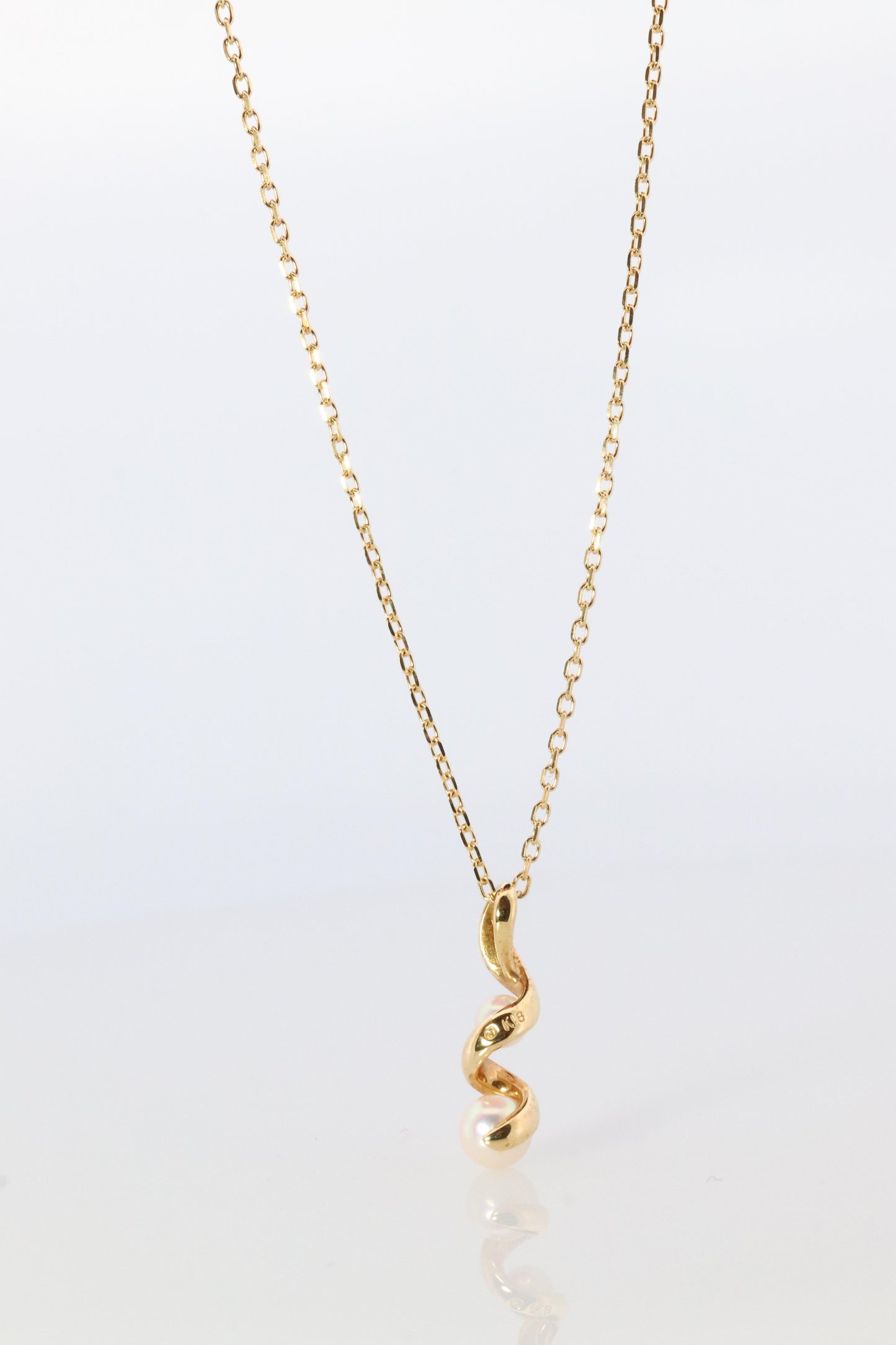 Mikimoto Pendant. 18k Gold Mikimoto Swirl Pearl Necklace.
