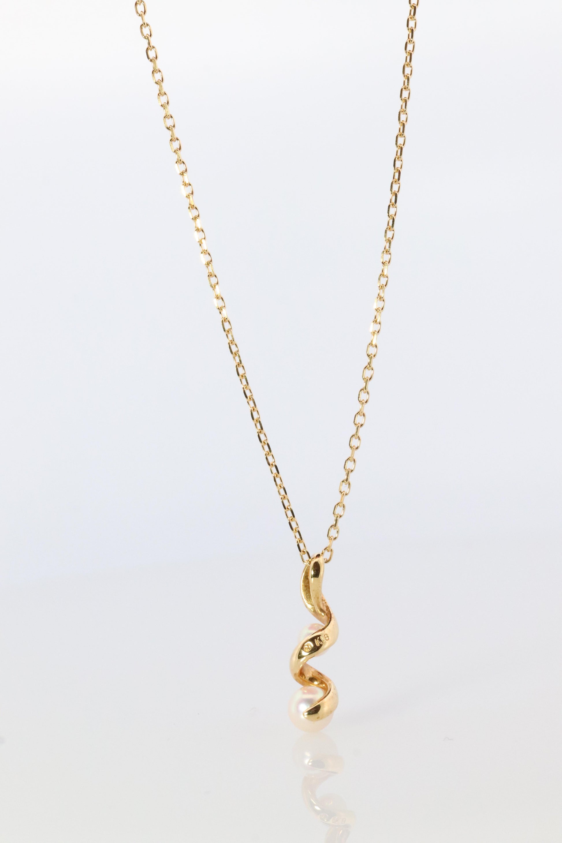 Mikimoto Pendant. 18k Gold Mikimoto Swirl Pearl Necklace.
