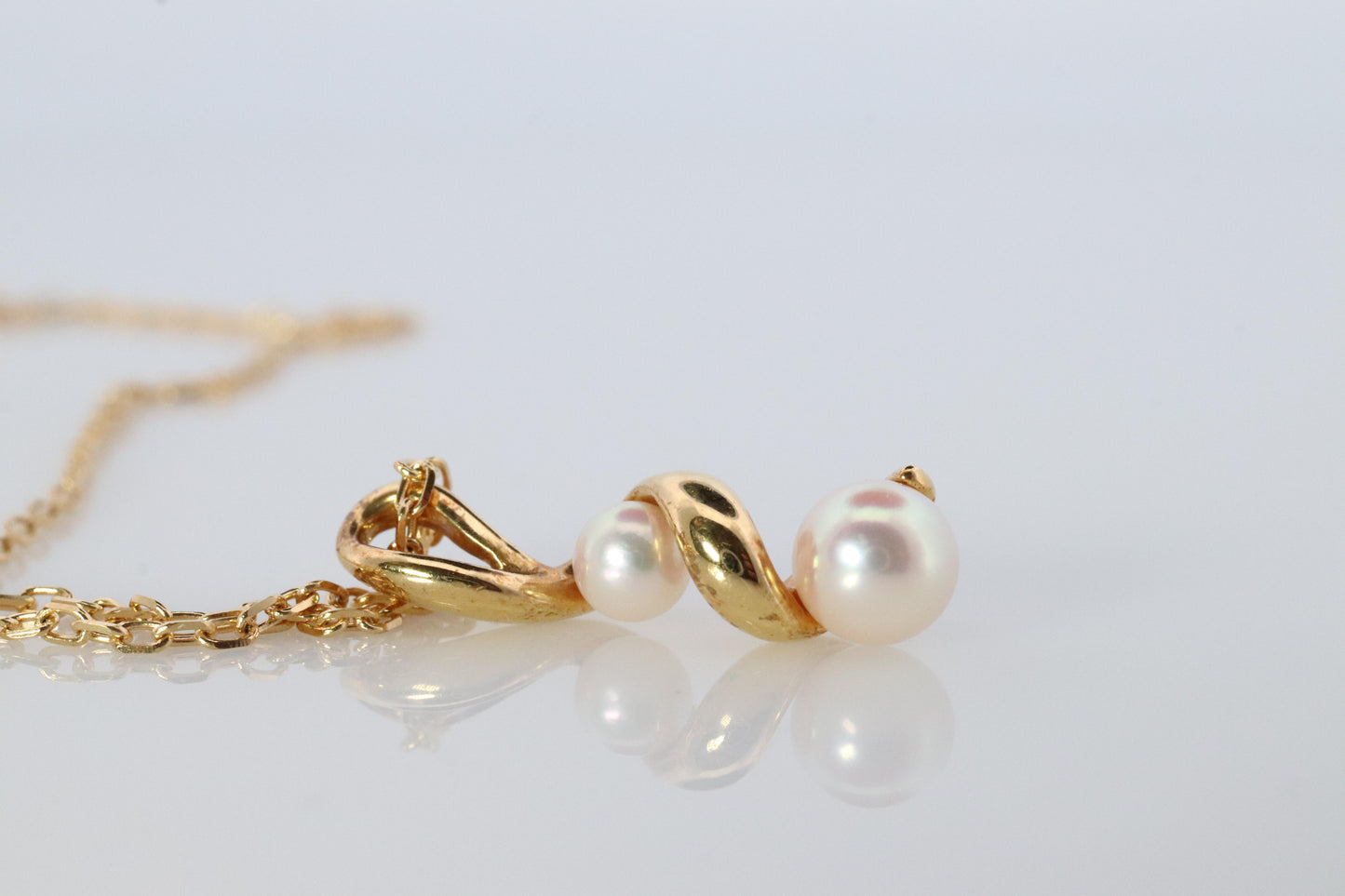 Mikimoto Pendant. 18k Gold Mikimoto Swirl Pearl Necklace.