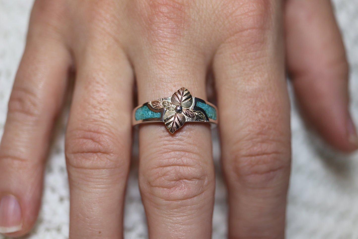 Black Hills Gold Turquoise Ring. Sterling Silver and 10k/12k Gold Leaves. Crushed Turquoise inlay.
