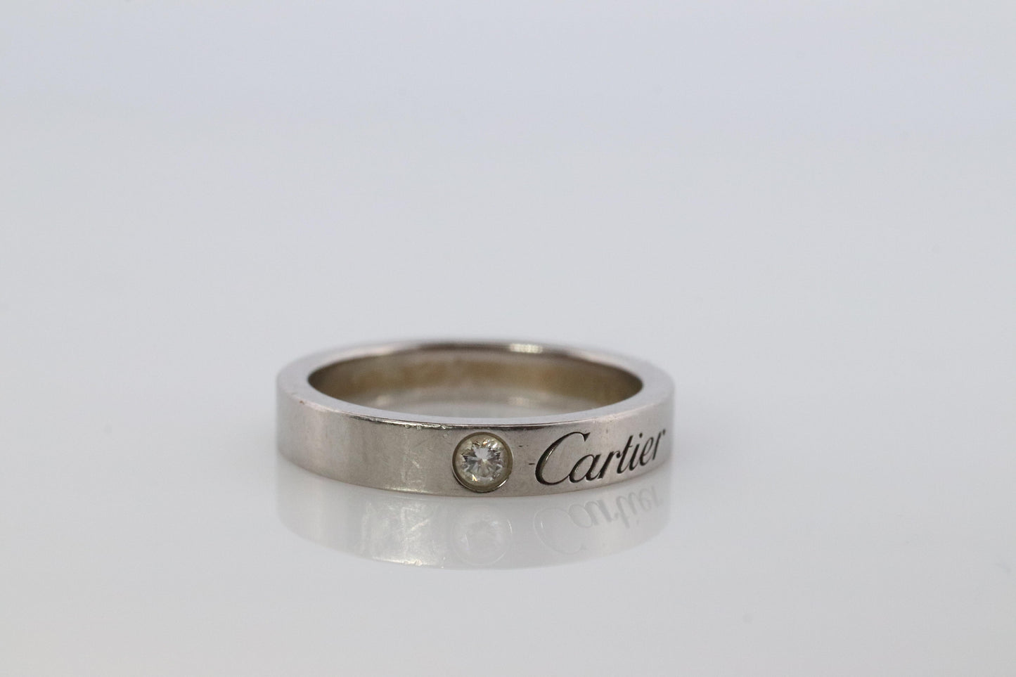 CARTIER Platinum Ring. Cartier Diamond Signature Bezel 3mm Band.