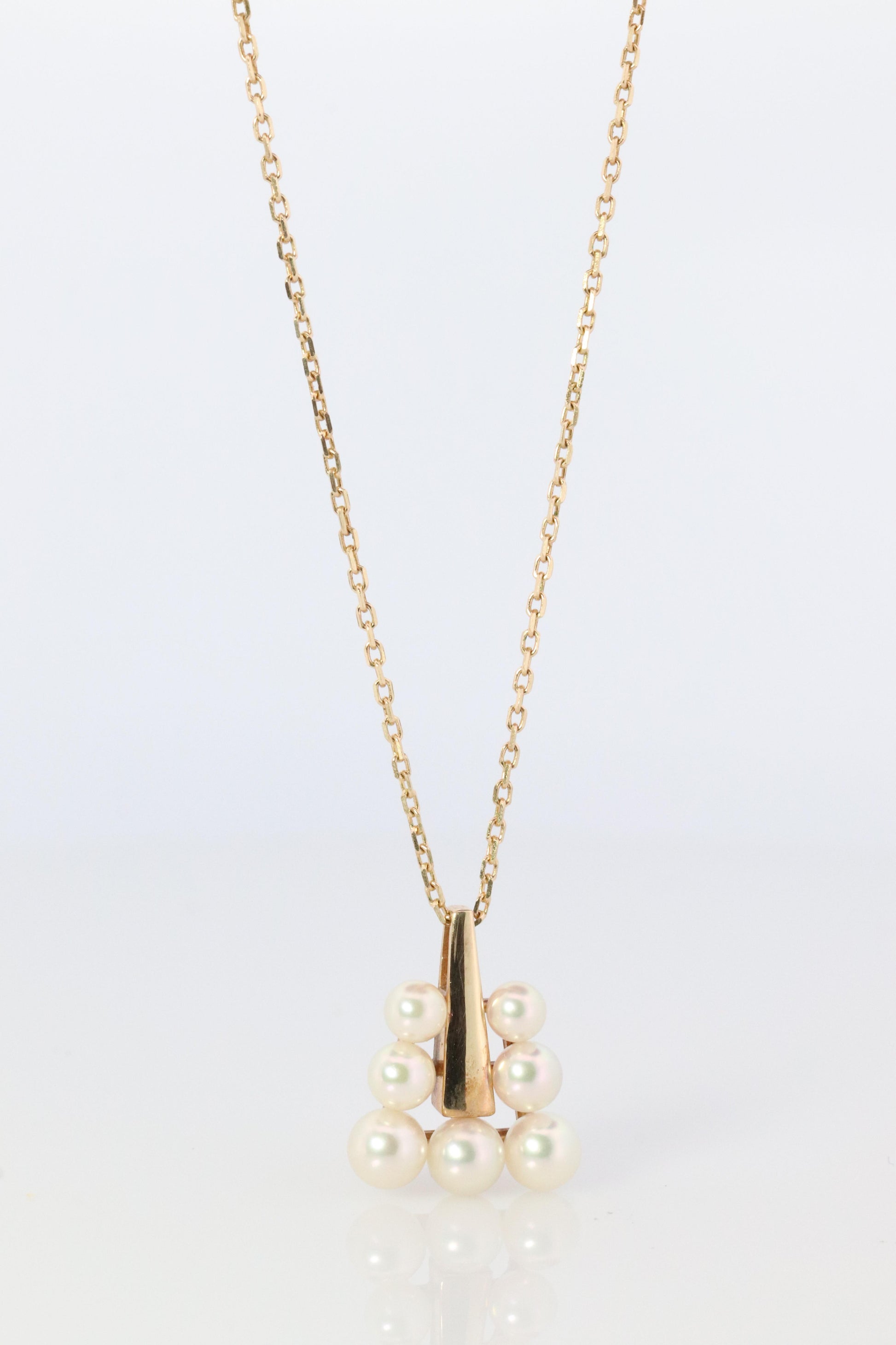 Mikimoto Pendant. 18k Gold Mikimoto Triangle Pyramid graduated Pearl Necklace.