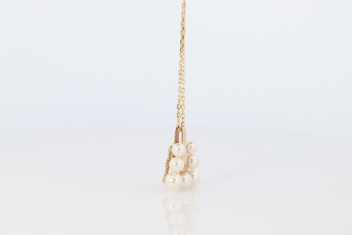 Mikimoto Pendant. 18k Gold Mikimoto Triangle Pyramid graduated Pearl Necklace.