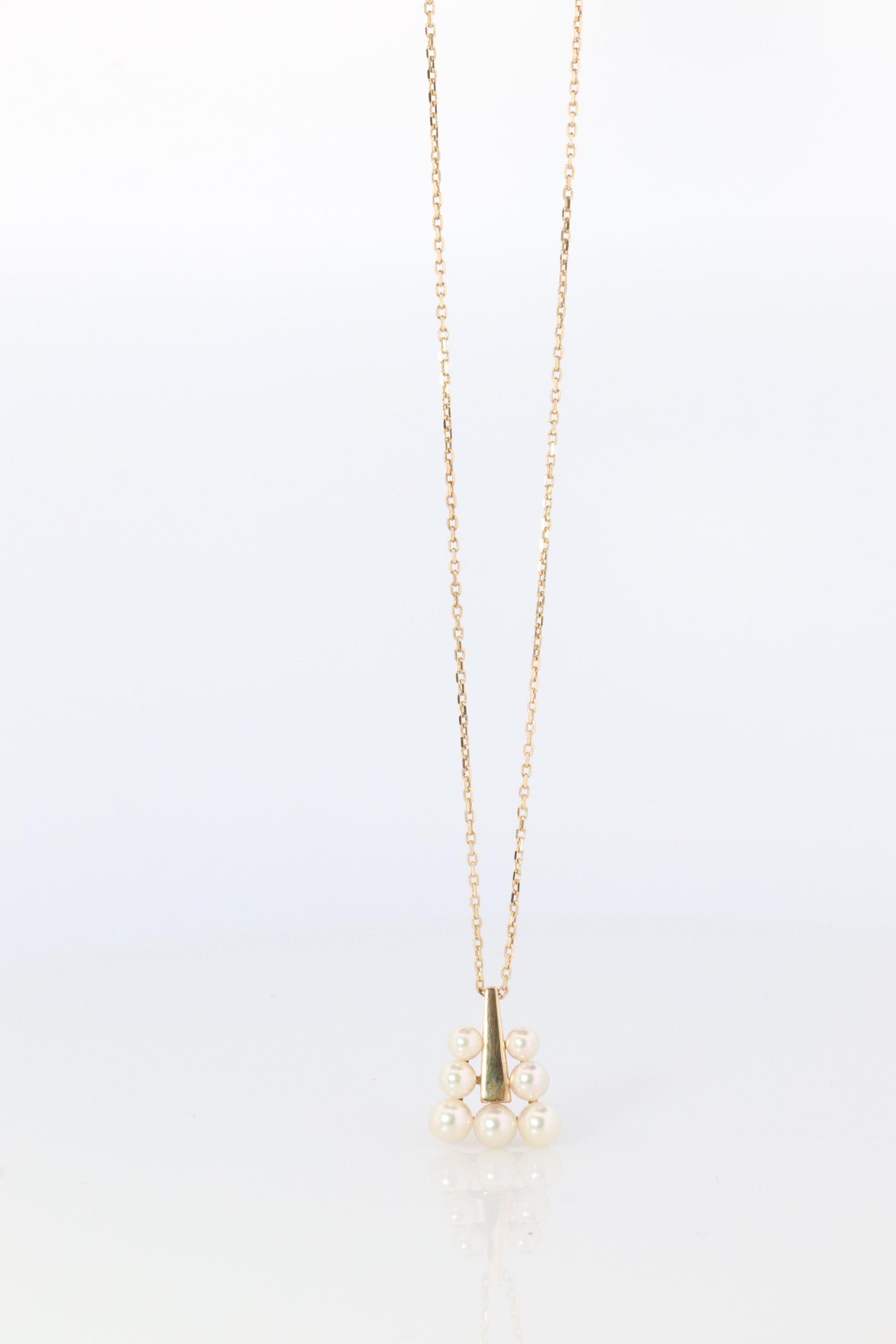 Mikimoto Pendant. 18k Gold Mikimoto Triangle Pyramid graduated Pearl Necklace.