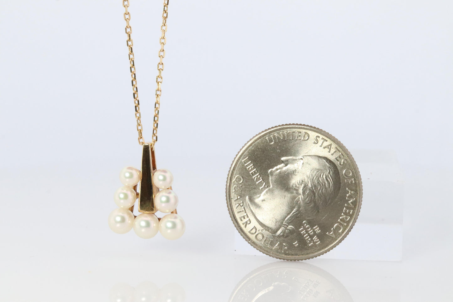 Mikimoto Pendant. 18k Gold Mikimoto Triangle Pyramid graduated Pearl Necklace.