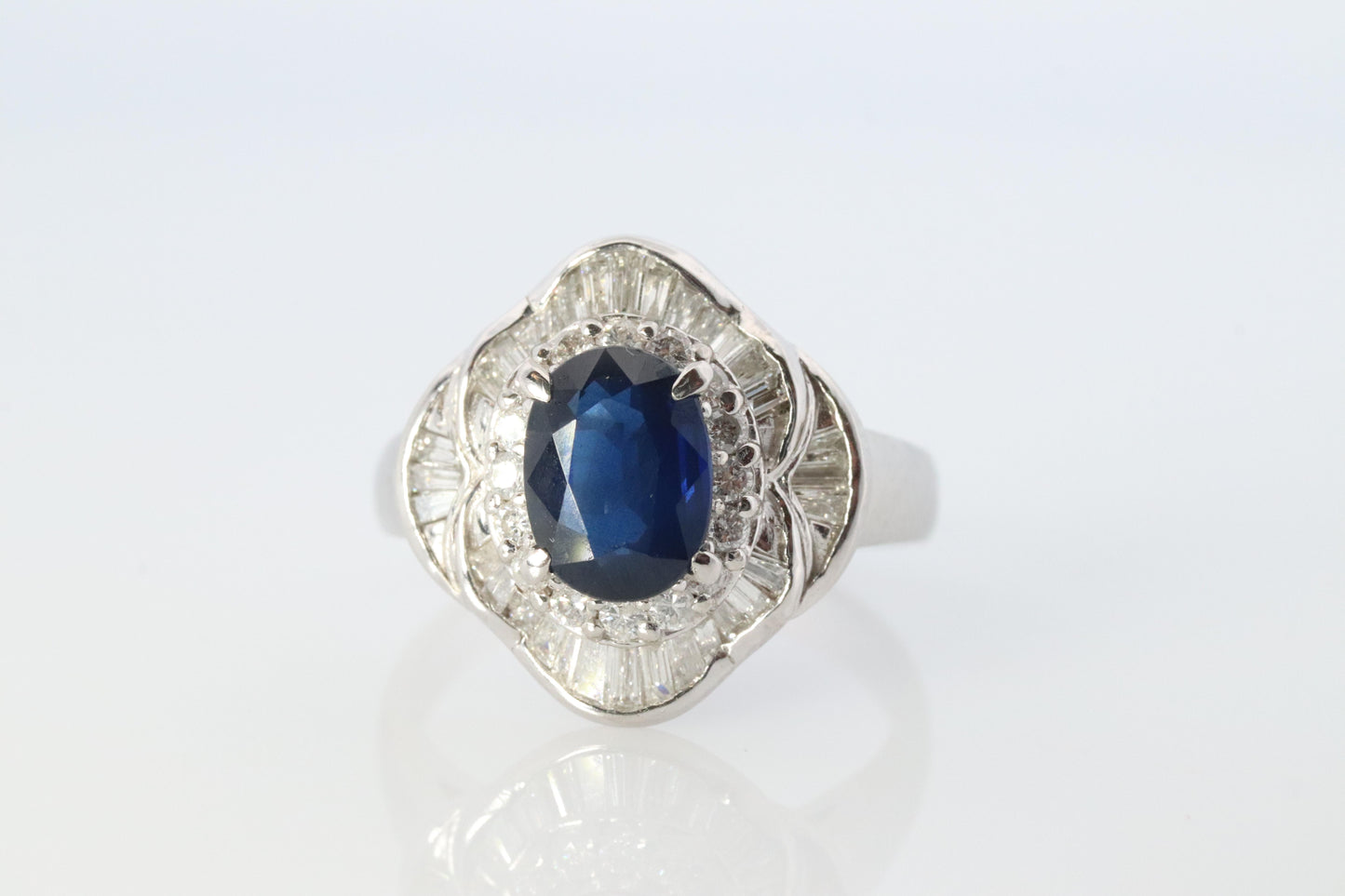 Sapphire and diamond Ballerina ring. Platinum Blue natural sapphire HALO ring