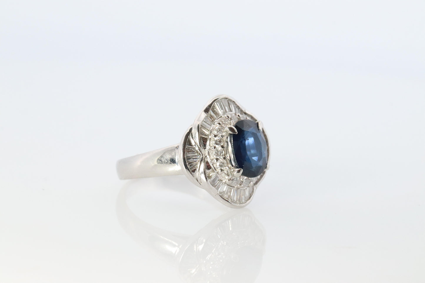 Sapphire and diamond Ballerina ring. Platinum Blue natural sapphire HALO ring