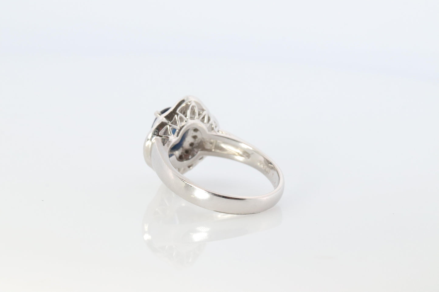 Sapphire and diamond Ballerina ring. Platinum Blue natural sapphire HALO ring