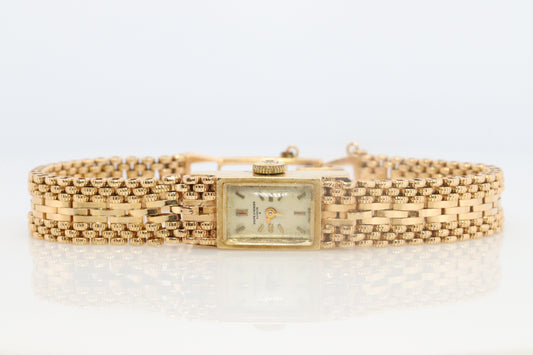 14k Baume and Mercier GENEVE Mechanical watch. 14k Panther bracelet/band.