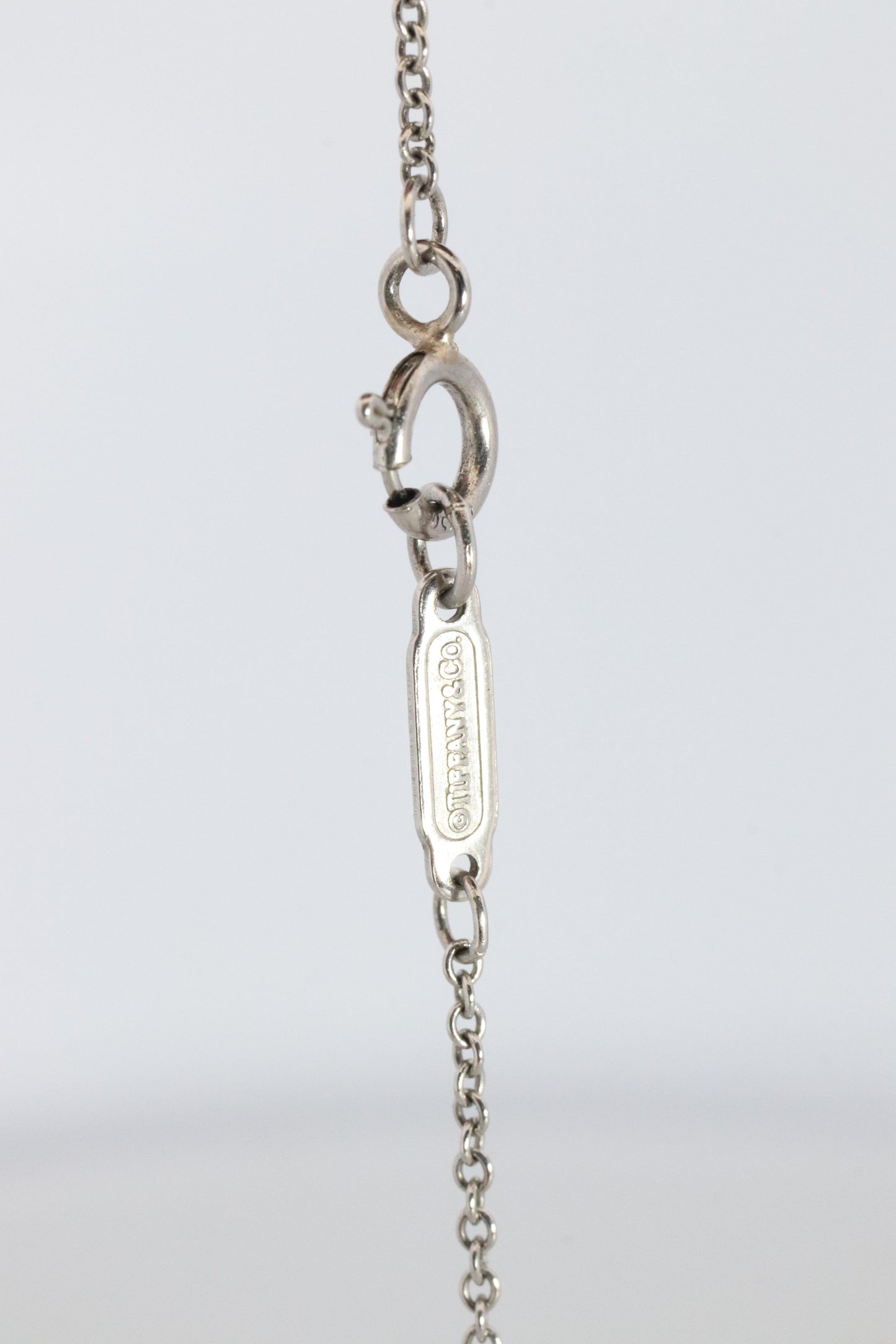 Tiffany Co Diamond Solitaire Necklace. Platinum 0.15ct Diamond Pendant.