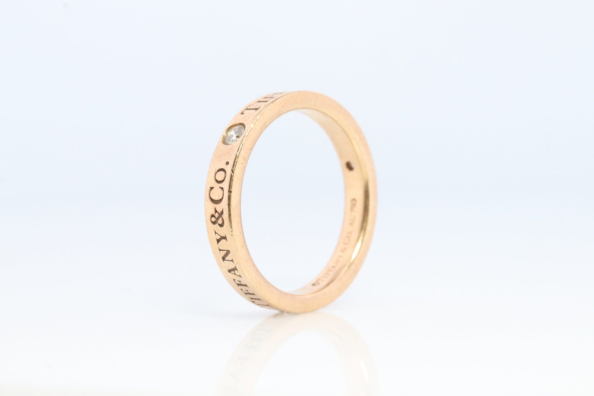 18k Tiffany and Co. band. 18k Tiffany Company Diamond wedding band. 18k Rose Gold Three diamond Bezel Vintage Tiffany & Co band.