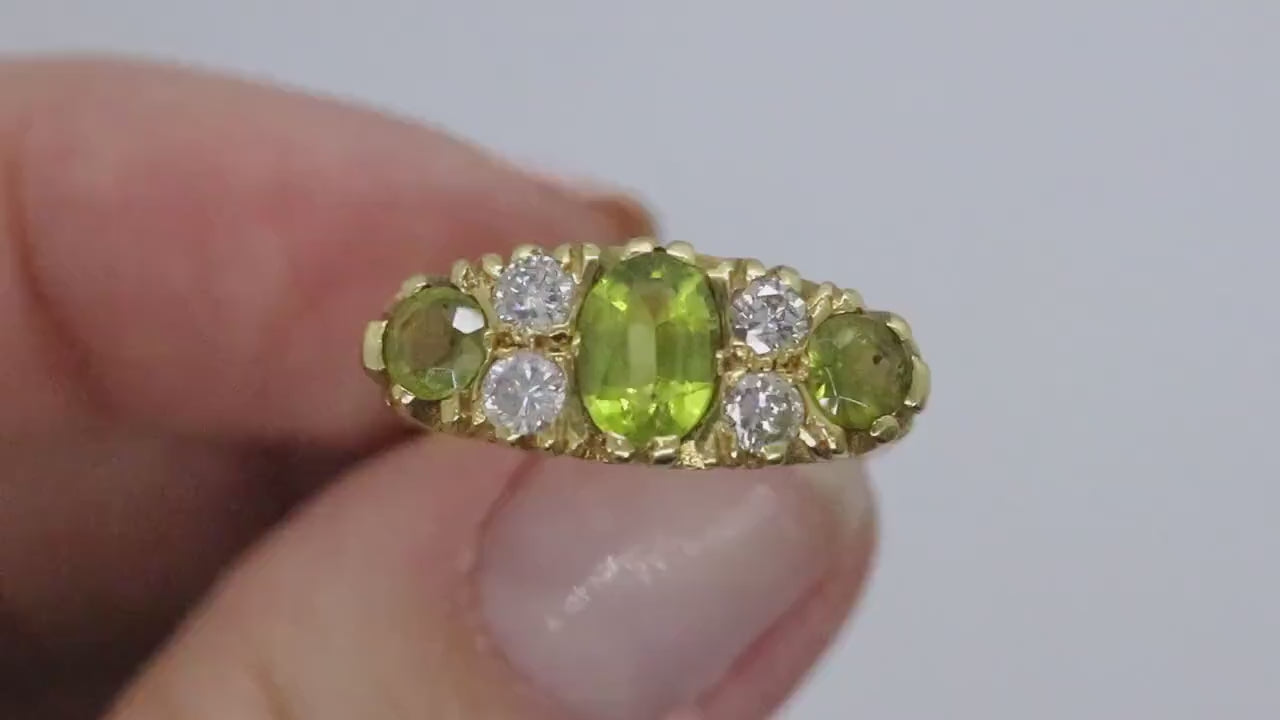 18k Large Peridot and Diamond Ring. Made in UK 1976. 6.4grams with 0.40ctw in diamonds