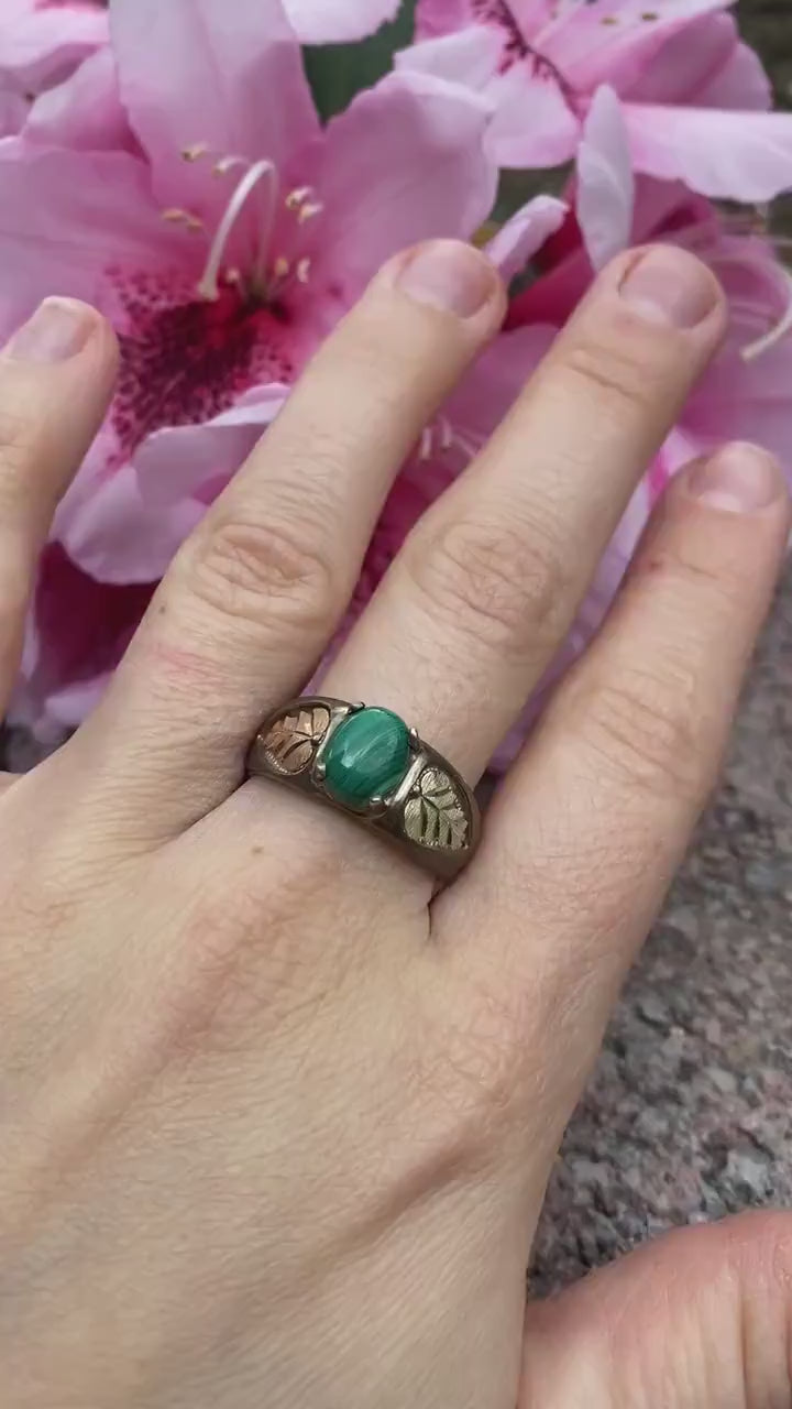 Black Hills Gold Sterling Silver Ring. Green Malachite cabochon with 10k gold inlays band.