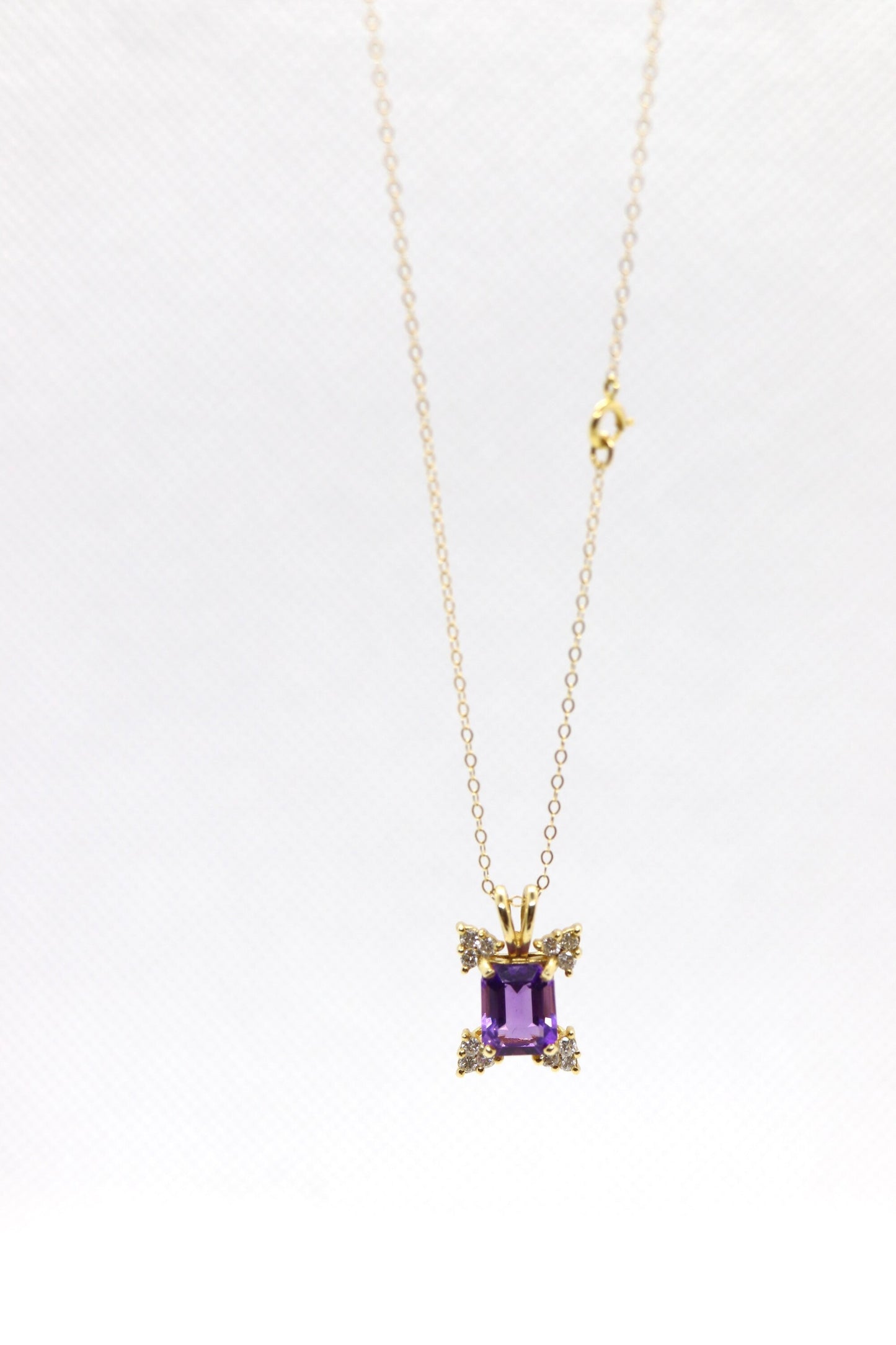 14k Amethyst emerald cut with Diamonds pendant. Diamond cluster star and 16in rolo necklace