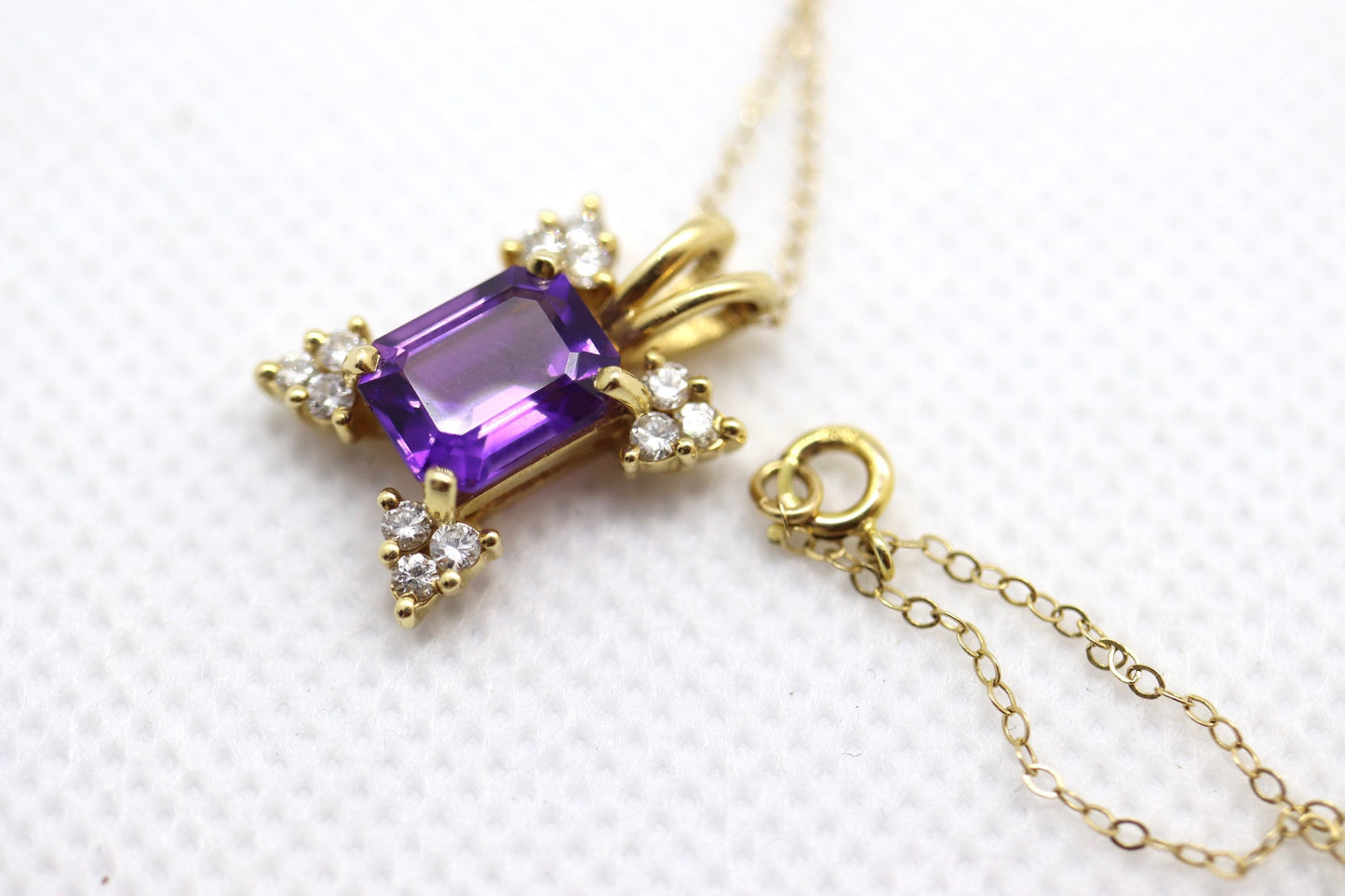 14k Amethyst emerald cut with Diamonds pendant. Diamond cluster star and 16in rolo necklace