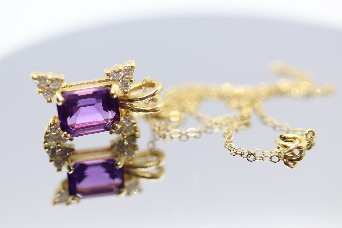 14k Amethyst emerald cut with Diamonds pendant. Diamond cluster star and 16in rolo necklace