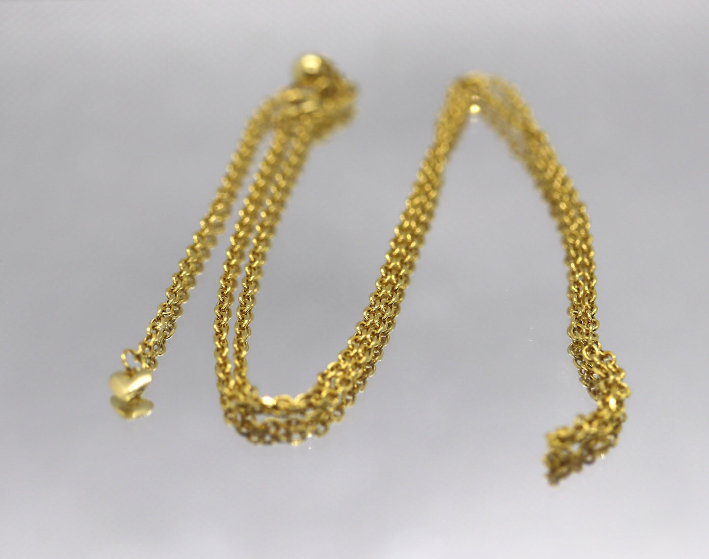 10k Adjustable Slide necklace. Beautiful heart charm with bead slider on oval rolo chain. 23.5in