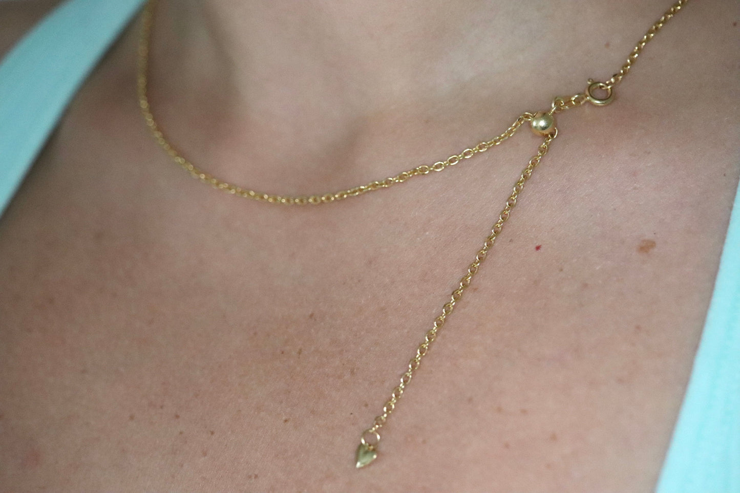 10k Adjustable Slide necklace. Beautiful heart charm with bead slider on oval rolo chain. 23.5in