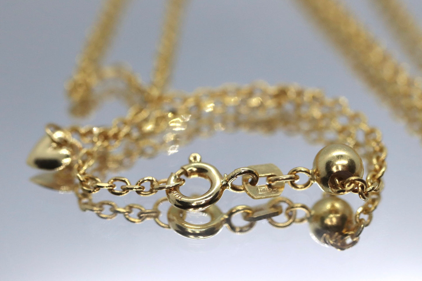 10k Adjustable Slide necklace. Beautiful heart charm with bead slider on oval rolo chain. 23.5in