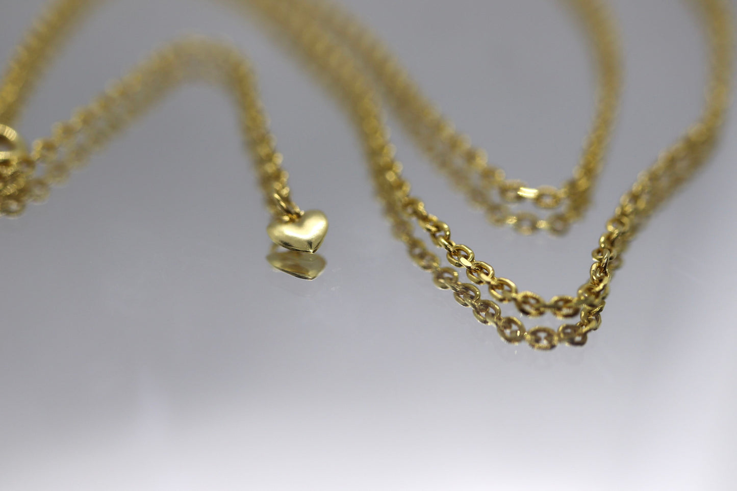 10k Adjustable Slide necklace. Beautiful heart charm with bead slider on oval rolo chain. 23.5in