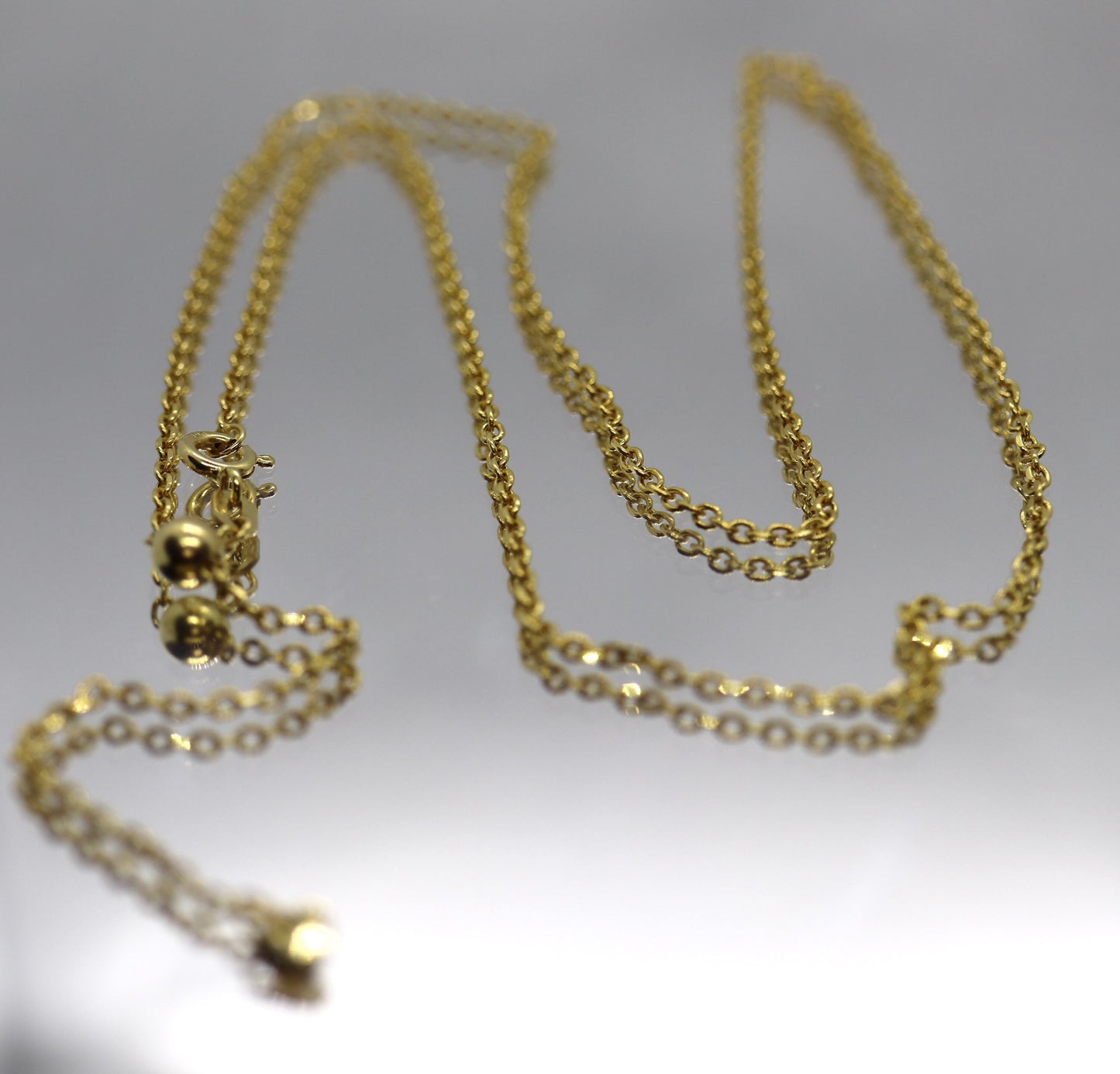 10k Adjustable Slide necklace. Beautiful heart charm with bead slider on oval rolo chain. 23.5in