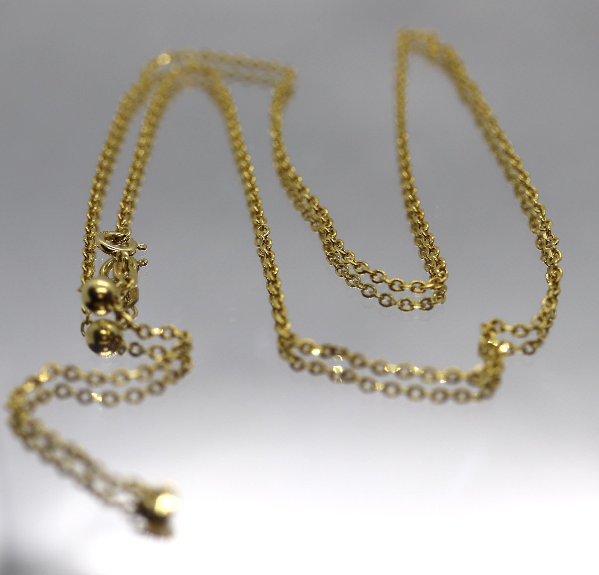 10k Adjustable Slide necklace. Beautiful heart charm with bead slider on oval rolo chain. 23.5in