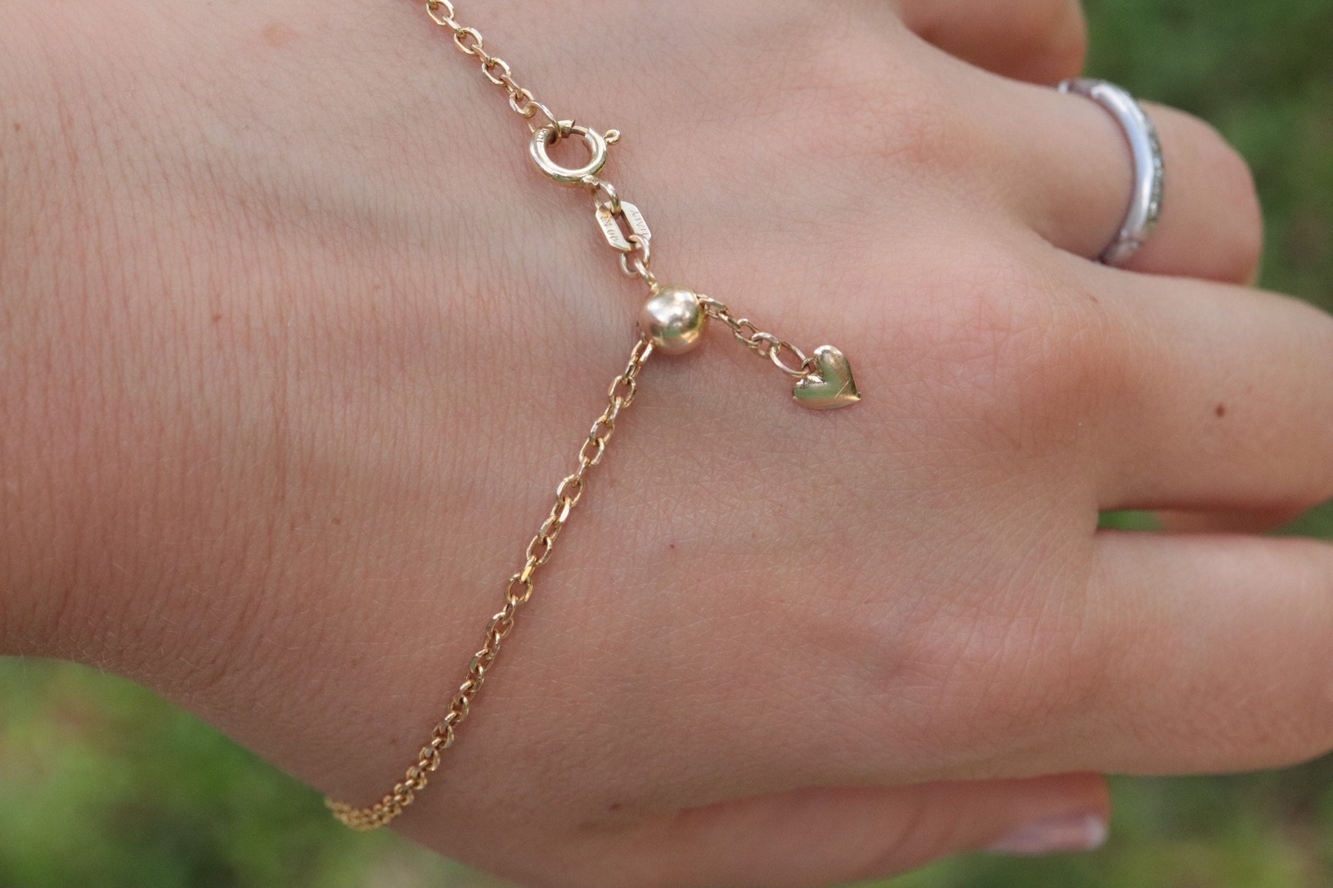 10k Adjustable Slide bracelet. Beautiful heart charm slider slide rolo chain bracelet 8in
