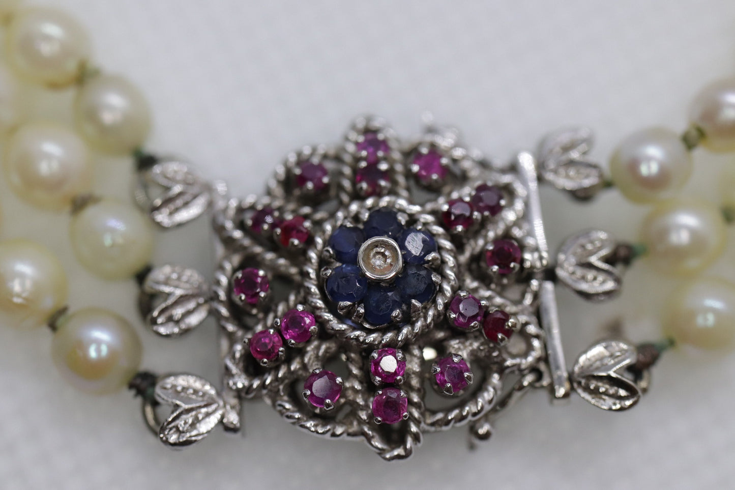 18k Sapphire Ruby Diamond Graduated Saltwater Pearl triple thread necklace.