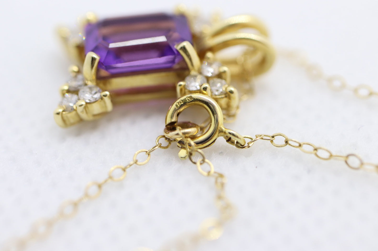 14k Amethyst emerald cut with Diamonds pendant. Diamond cluster star and 16in rolo necklace