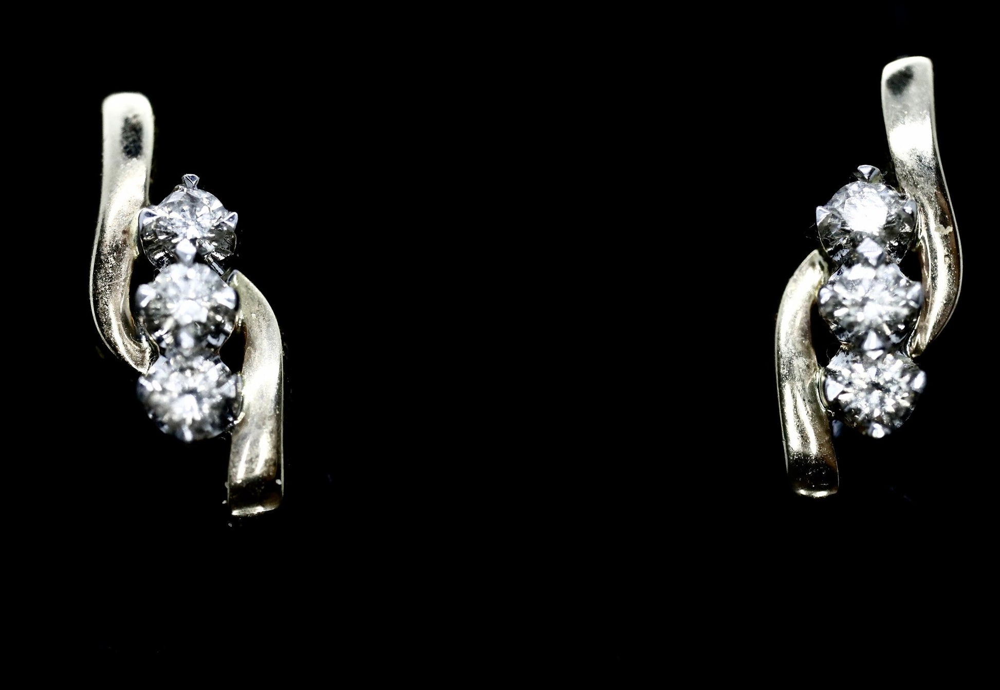 14k Diamond Earrings. 3 stone DIAMOND bypass drop earrings
