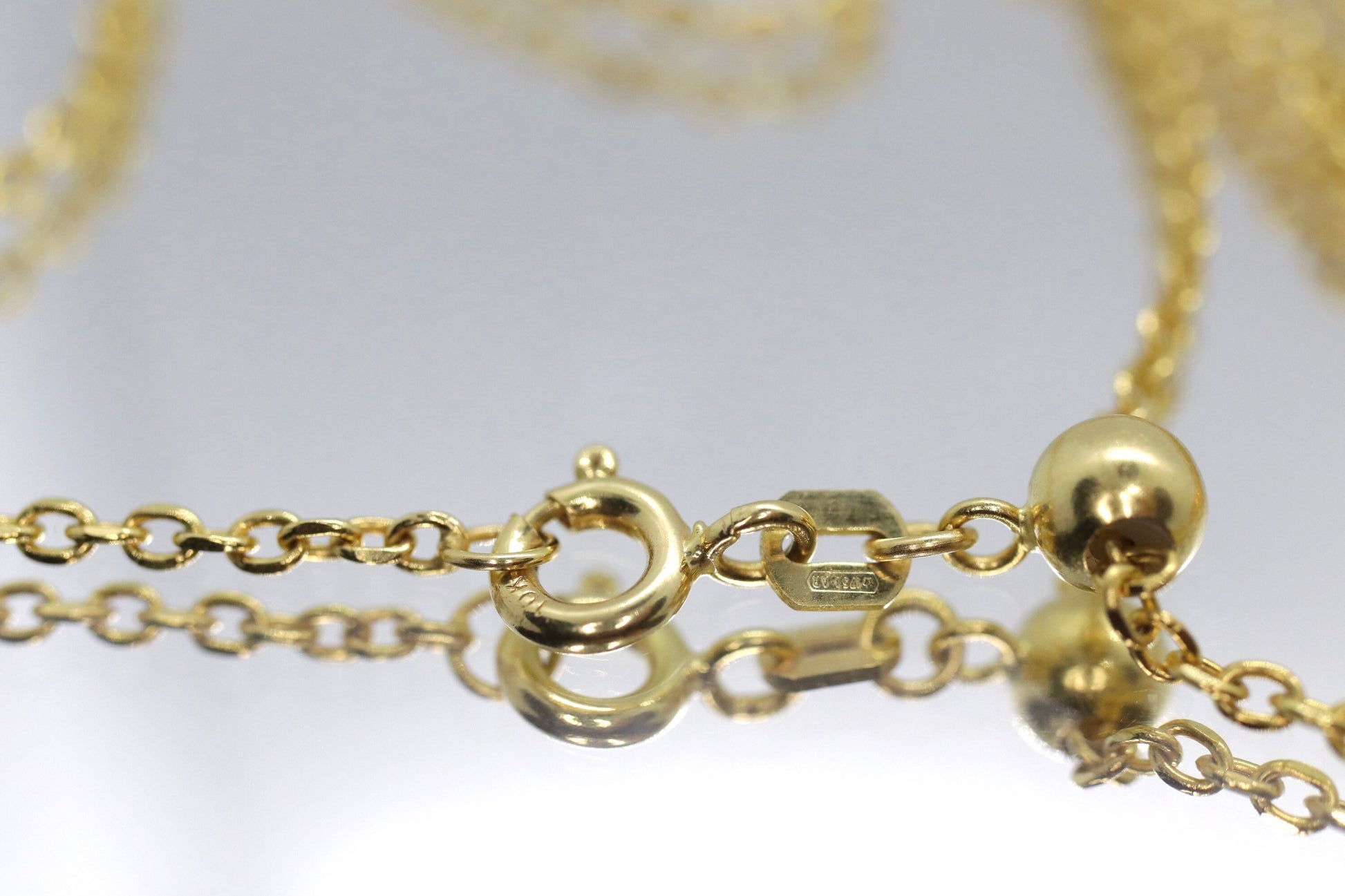 10k Adjustable Slide necklace. Beautiful heart charm with bead slider on oval rolo chain. 23.5in