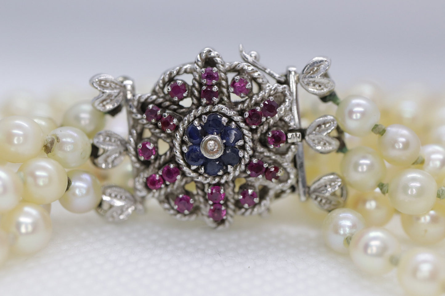 18k Sapphire Ruby Diamond Graduated Saltwater Pearl triple thread necklace.