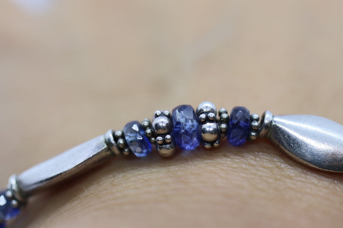 Laura Gibson Bracelet. Sterling Silver and with Dangling Faceted Gems - Topaz - (595)