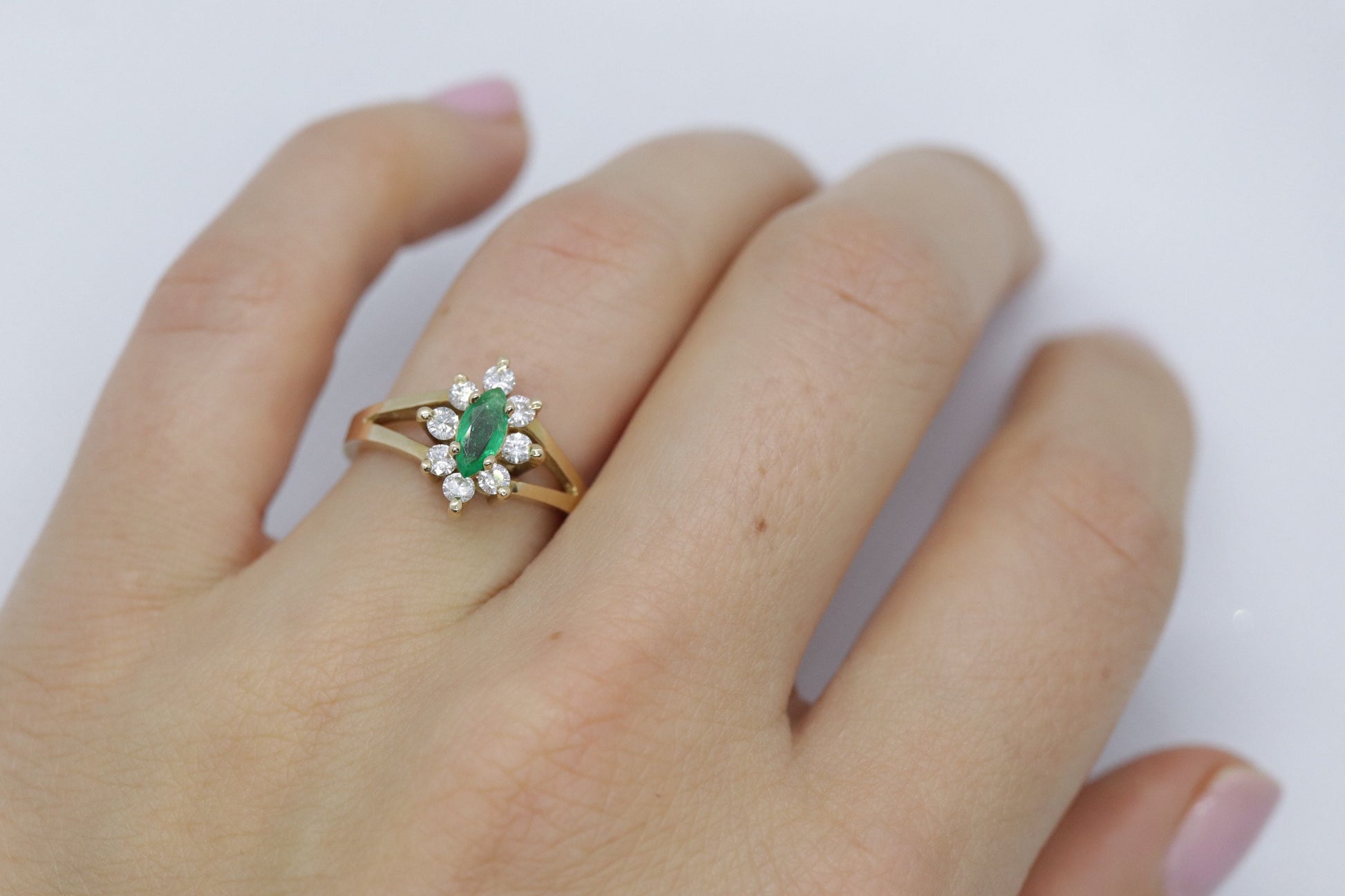 14k Marquise Emerald and Diamond Halo yellow gold ring. 0.36ctw in diamonds