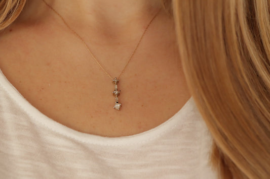 10k 3 Diamond Past Present Future Journey Pendant. 0.60ctw Princess and Baguette diamonds. 10k Yellow gold Rope necklace. (88)