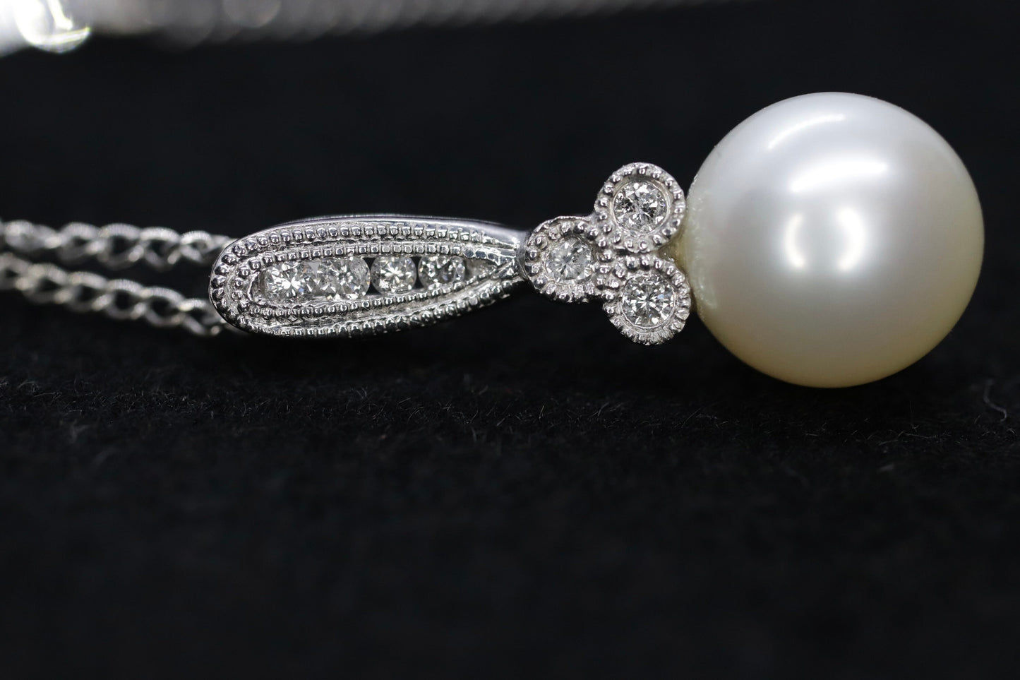 Pearl diamond pendant and necklace. 10k Dangle Pearl pendant with cable necklace (14)(00.90)
