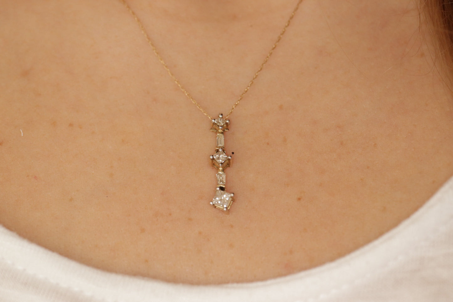 10k 3 Diamond Past Present Future Journey Pendant. 0.60ctw Princess and Baguette diamonds. 10k Yellow gold Rope necklace. (88)