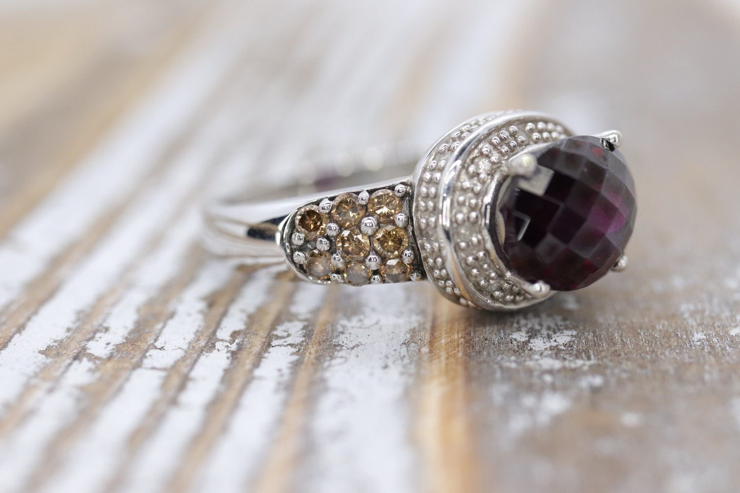 14k Large Faceted Garnet solitaire ring with champagne diamonds. (117)