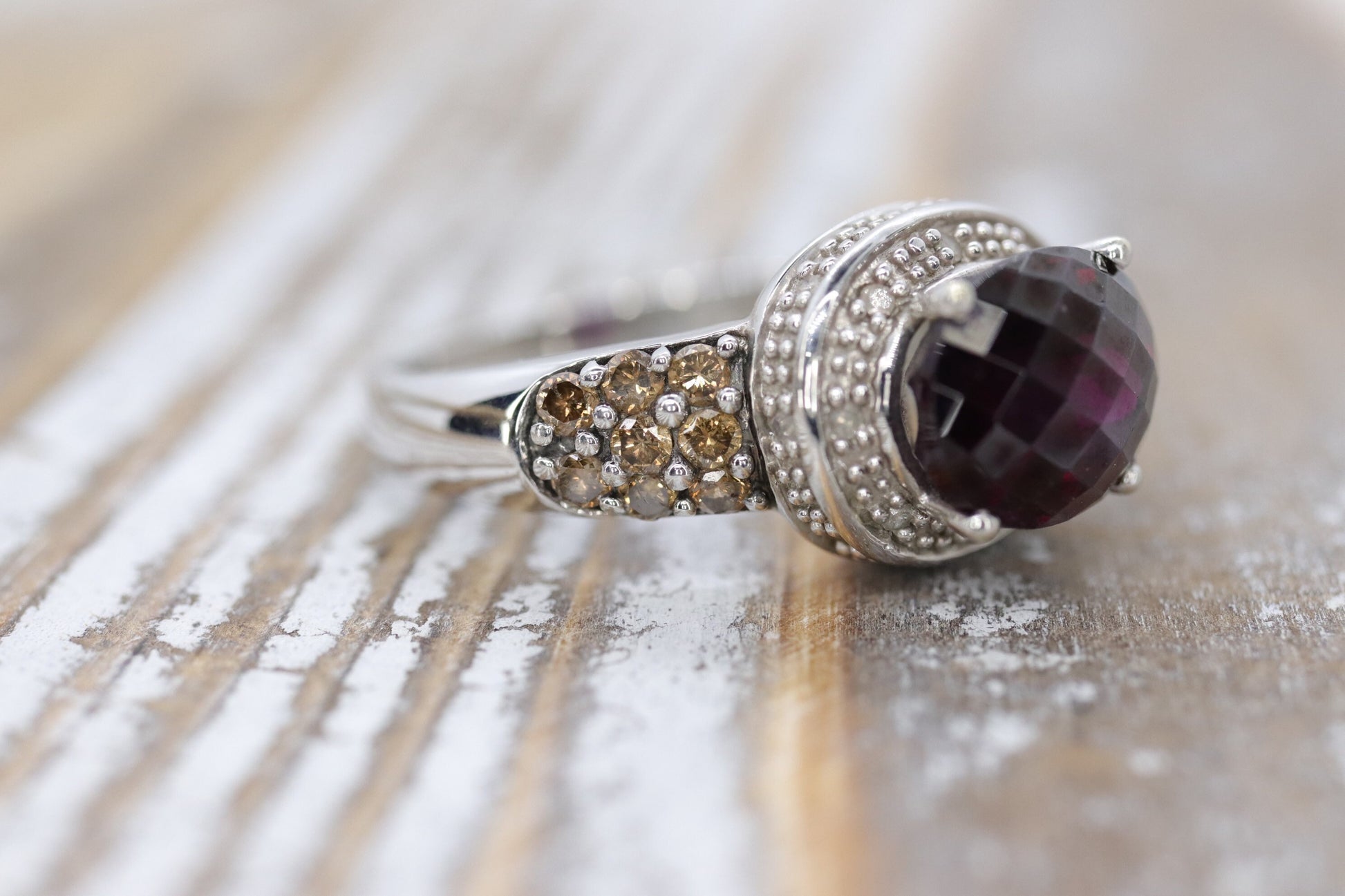 14k Large Faceted Garnet solitaire ring with champagne diamonds. (117)