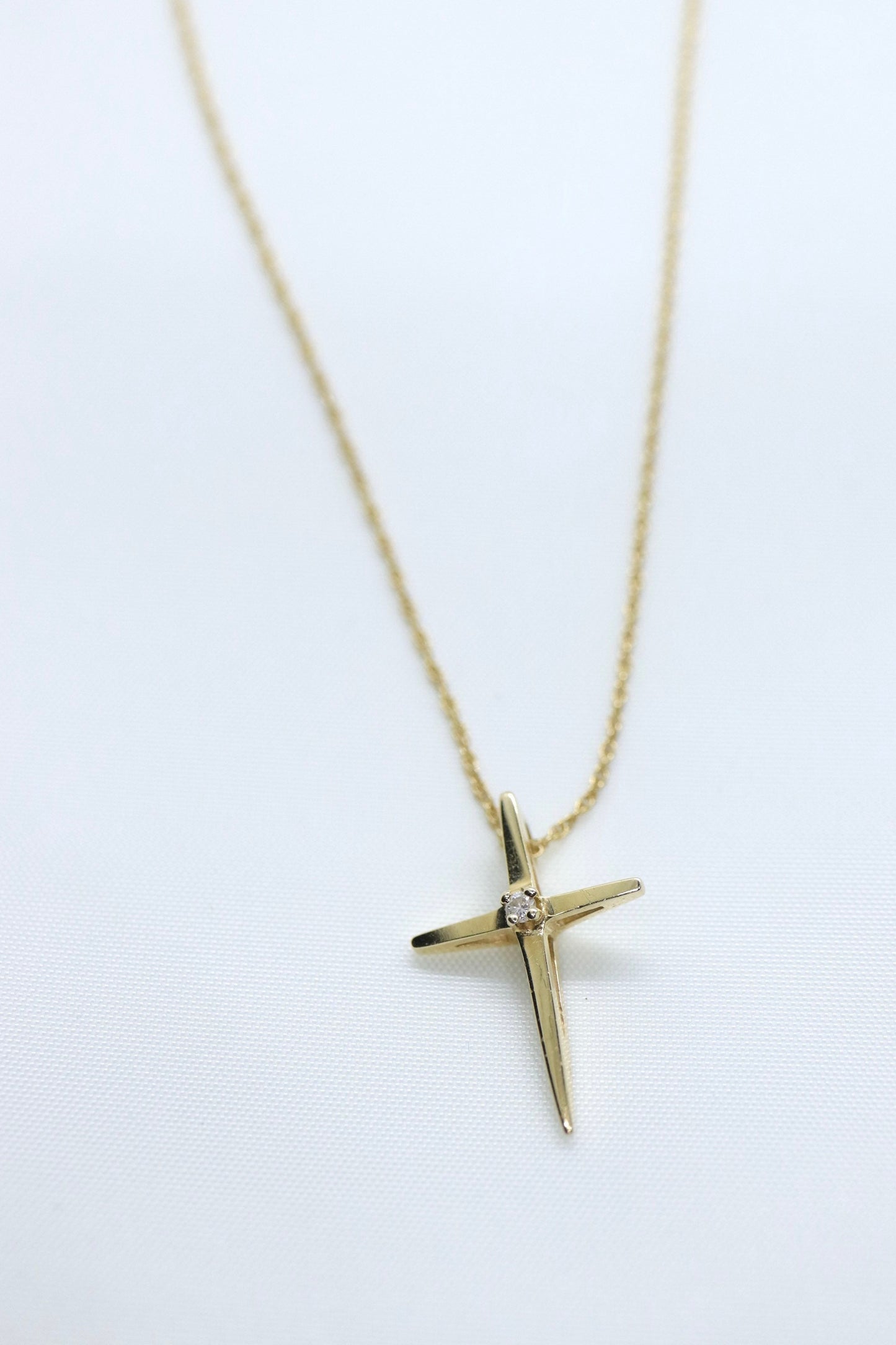 14k Diamond cross. 14k Yellow gold crucifix with twisted rope necklace chain