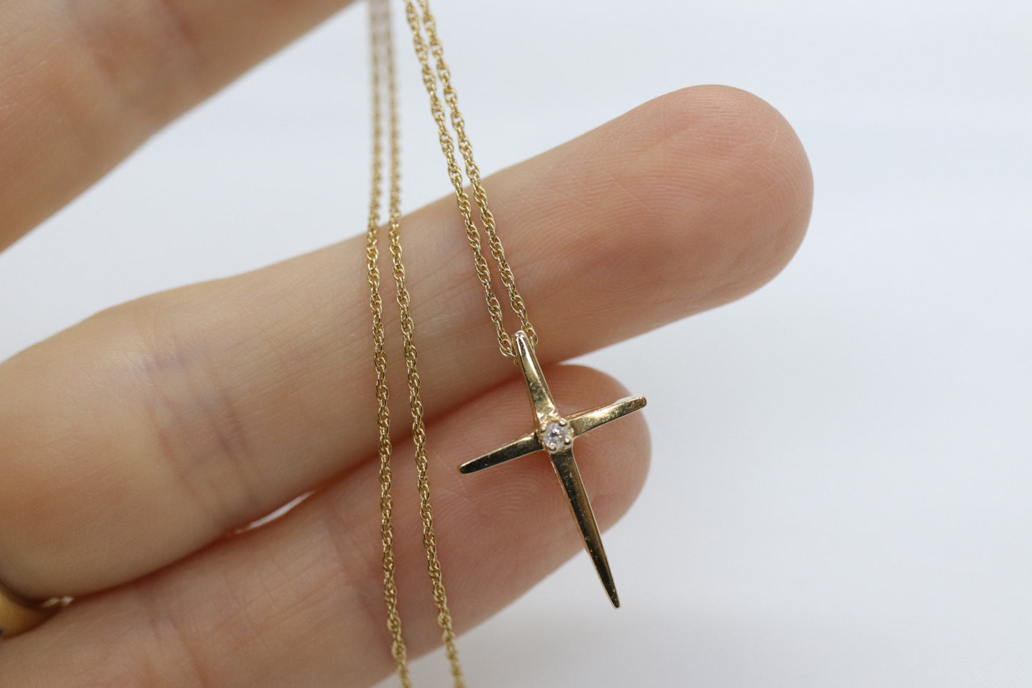 14k Diamond cross. 14k Yellow gold crucifix with twisted rope necklace chain